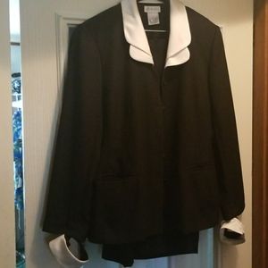 Two pieces dress lined suit with removable cuffs.